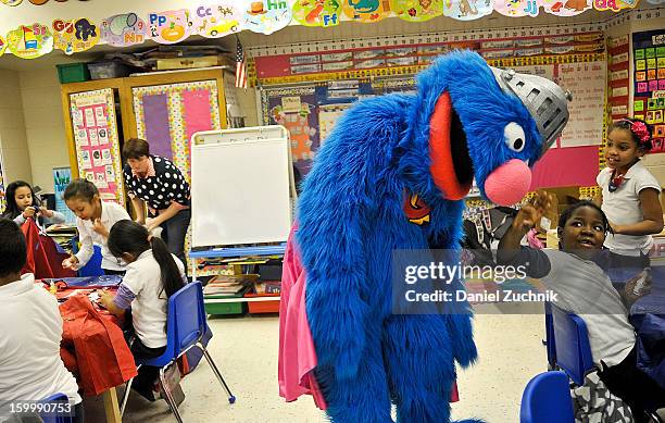 Super Grover teaches kids to be a super hero at the WHEDCo classroom on January 24, 2013 in New York City.