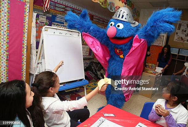 Sesame Street Live's Super Grover teach children from WHEDCo how to be super heroes on January 24, 2013 in New York City.