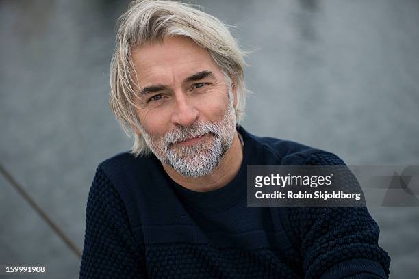 mature man in blue sweater - man 45 stock pictures, royalty-free photos & images