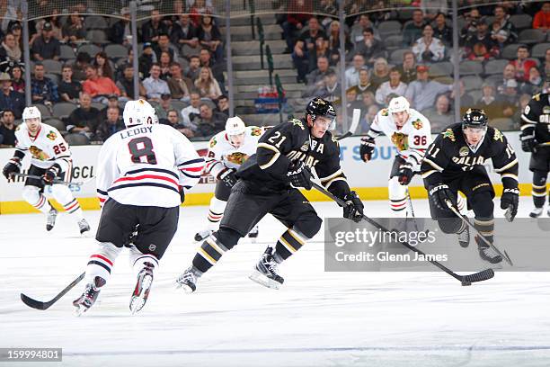 Loui Eriksson of the Dallas Stars handles the puck against Nick Leddy of the Chicago Blackhawks at the American Airlines Center on January 24, 2013...