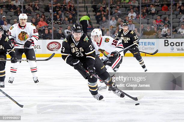 Tom Wandell of the Dallas Stars handles the puck against Marcus Kruger of the Chicago Blackhawks at the American Airlines Center on January 24, 2013...