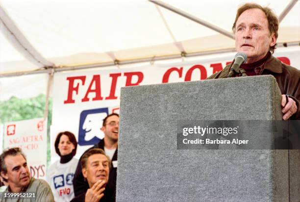 American TV host Dick Cavett speaks from a lectern during a joint SAG-AFTRA protest in Bryant Park, New York, New York, June 14, 2000. Among those...