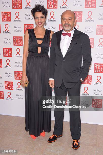 Farida Khelfa and Christian Louboutin attend the Sidaction Gala Dinner 2013 at Pavillon d'Armenonville on January 24, 2013 in Paris, France.