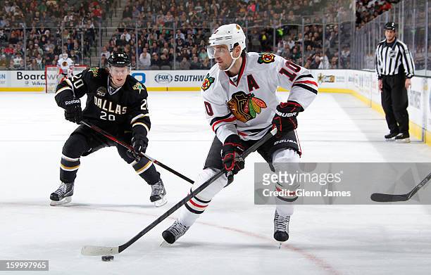 Patrick Sharp of the Chicago Blackhawks handles the puck against Cody Eakin of the Dallas Stars at the American Airlines Center on January 24, 2013...