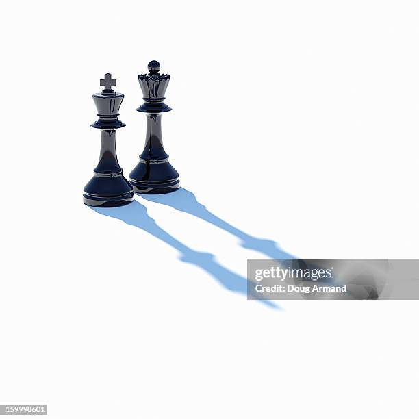 king and queen chess pieces on white - chess concept stock pictures, royalty-free photos & images