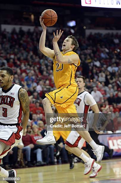 Nathan Sobey of the Wyoming Cowboys drives to the basket against Anthony Marshall of the UNLV Rebels at the Thomas & Mack Center January 24, 2013 in...