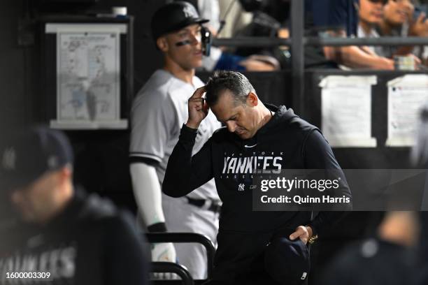 Manager Aaron Boone of the New York Yankees leaves the game after being ejected by home umpire Laz Diaz in the eighth inning against the Chicago...