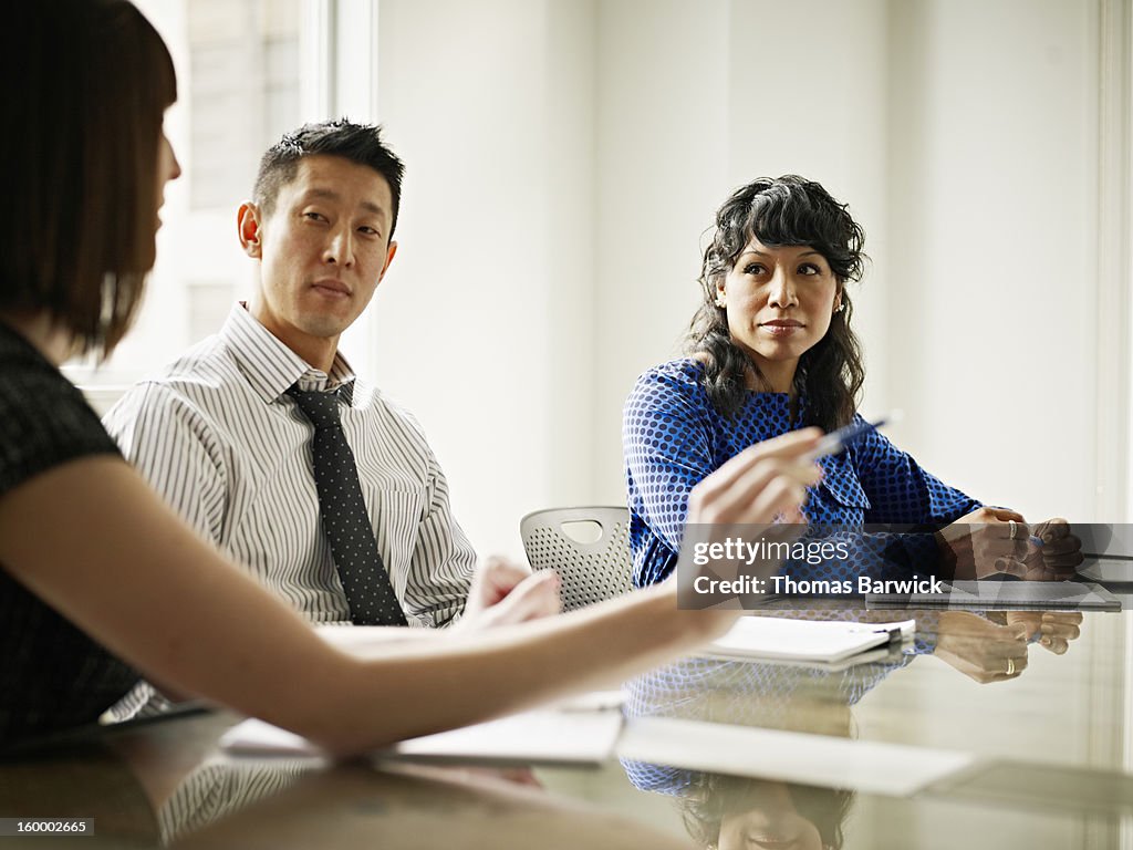 Group of coworkers in discussion in office