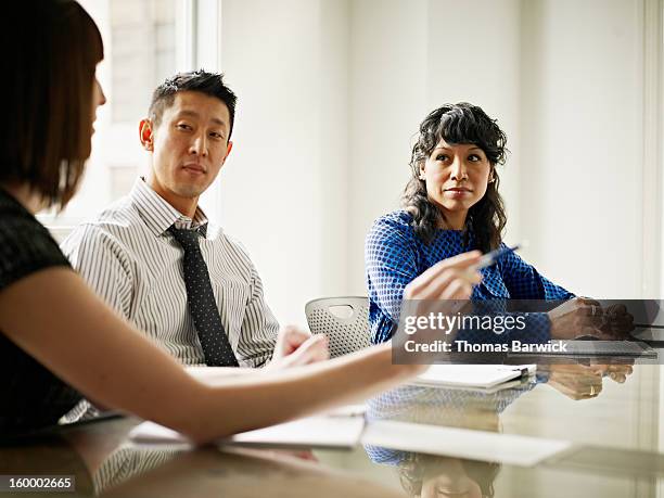 group of coworkers in discussion in office - native korean 個照片及圖片檔