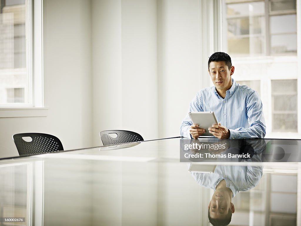 Businessman in office with digital tablet