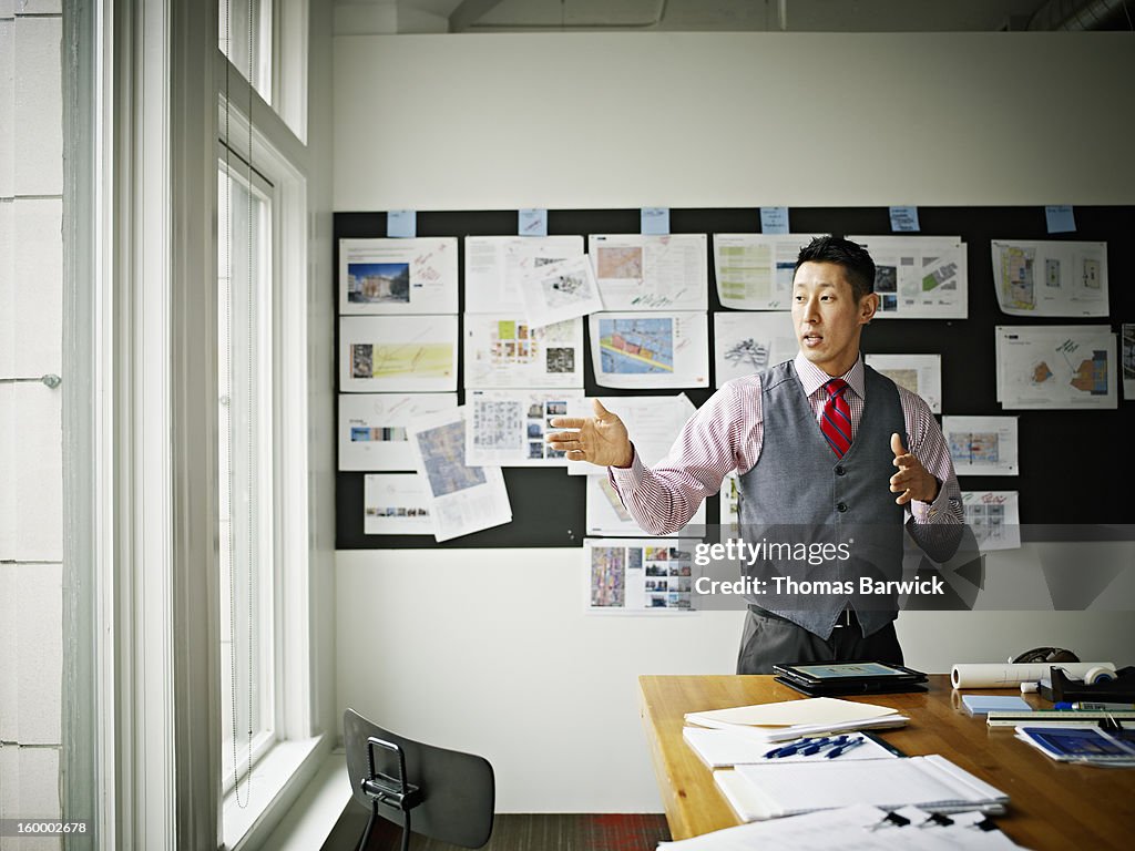 Businessman explaining project in office