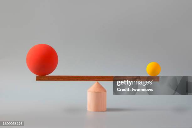 equality concept still life with balancing scale and spheres - stock photo. - scale stock pictures, royalty-free photos & images