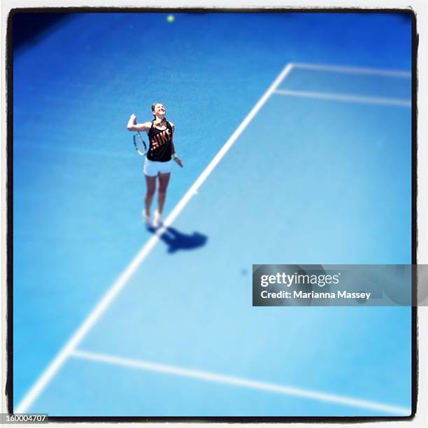 Victoria Azarenka of Belarus serves in a practice session on day nine of the 2013 Australian Open at Melbourne Park on January 22, 2013 in Melbourne,...