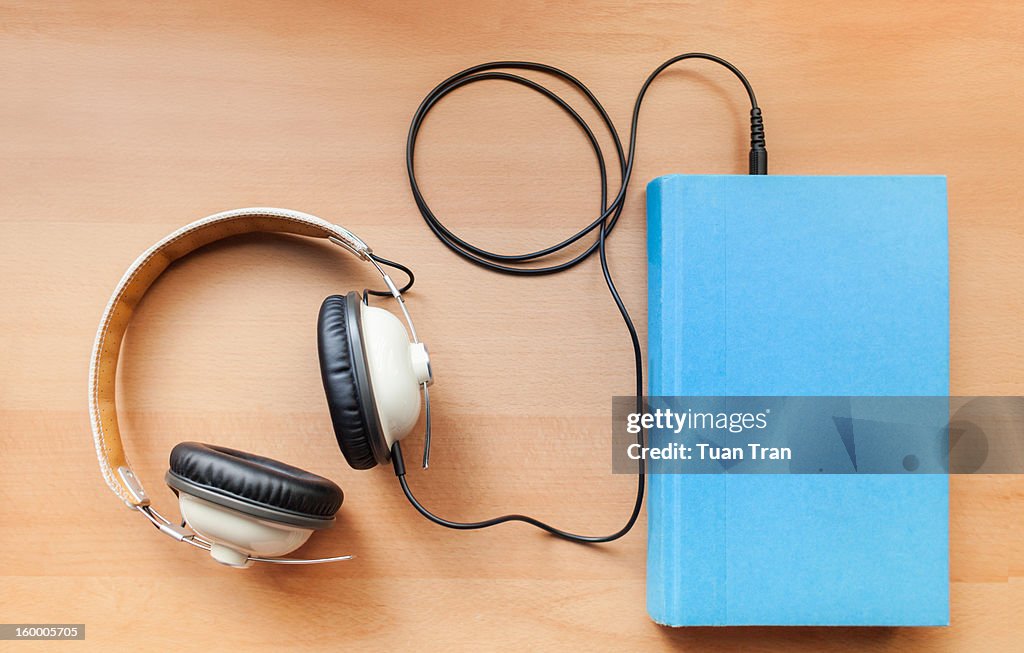 Headphones and a book