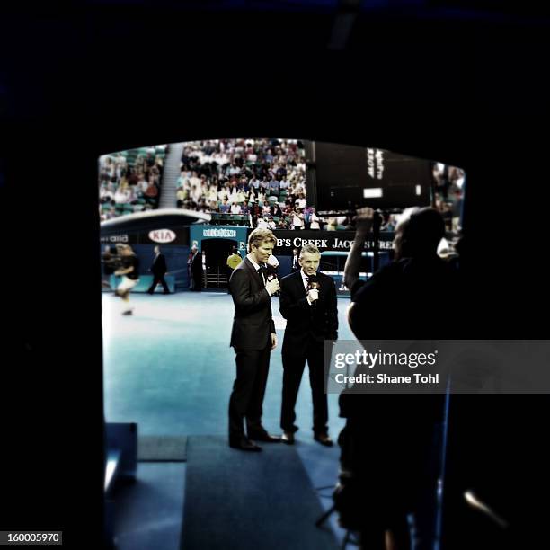 Presenters Jim Courier and Bruce McAvaney are seen ahead of the men's Quarterfinal match between Roger Federer of Switzerland and Jo-Wilfred Tsonga...