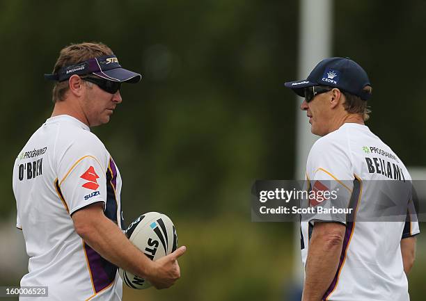 Adam O'Brien, Storm development coach and Craig Bellamy, coach of the Storm talk during a Melbourne Storm NRL training session at Gosch's Paddock on...