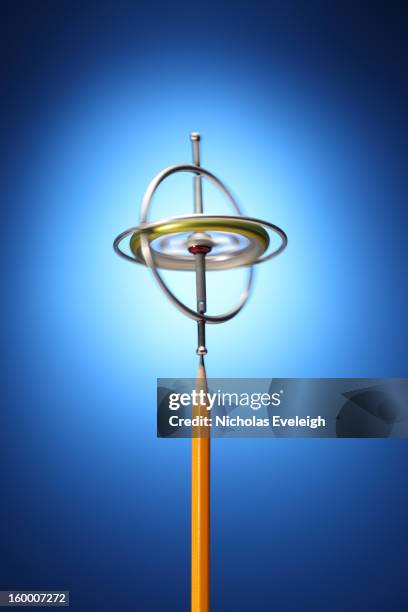 gyroscope and pencil - gyroscope stock pictures, royalty-free photos & images