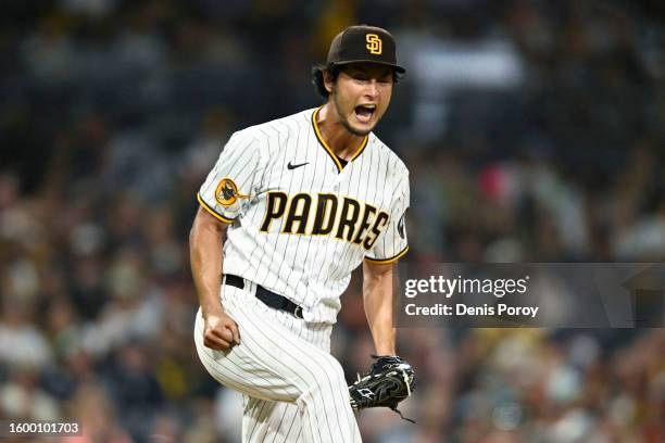 Yu Darvish of the San Diego Padres reacts after striking out the last batter during the fifth inning of a baseball game against the Baltimore Orioles...