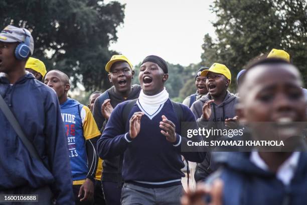 The team from Jabulani Technical Secondary School in Soweto on May 6, 2023 sing and dance ahead of a match against St. John College. The high school...