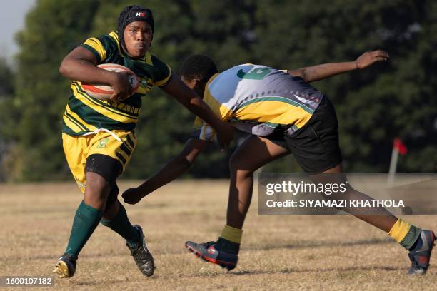 Sonwabo Buso from Soweto Jabulani Technical Secondary School U16 rugby runs with the ball during a match against Vryburger high school in...