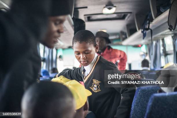 The team is seen on a school bus leaving from Jabulani technical Secondary School in Soweto on May 6, 2023 ahead of a match against St. John College....