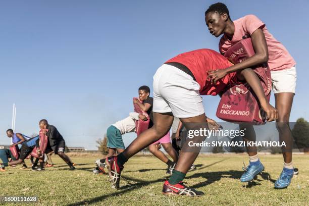 The Jabulani Technical Secondary School U16 rugby team practice at the school in Soweto on May 24, 2023. The high school rugby club, located in...