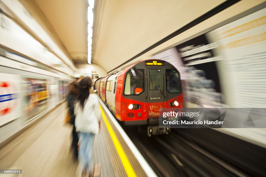 A London Underground train at a station.