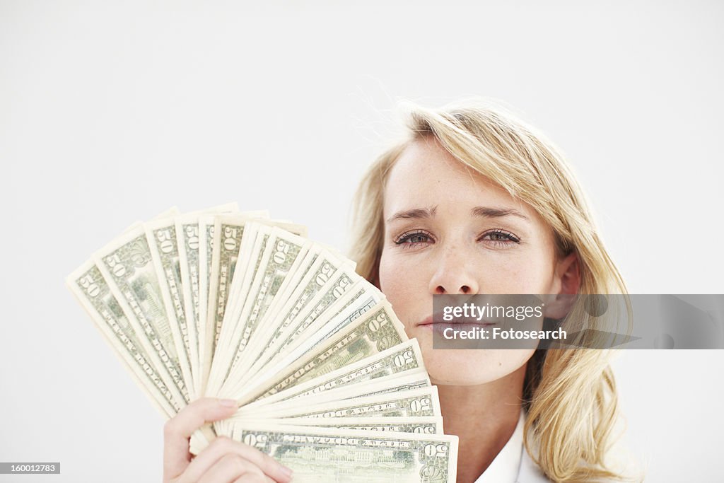 Girl with a dollars fan