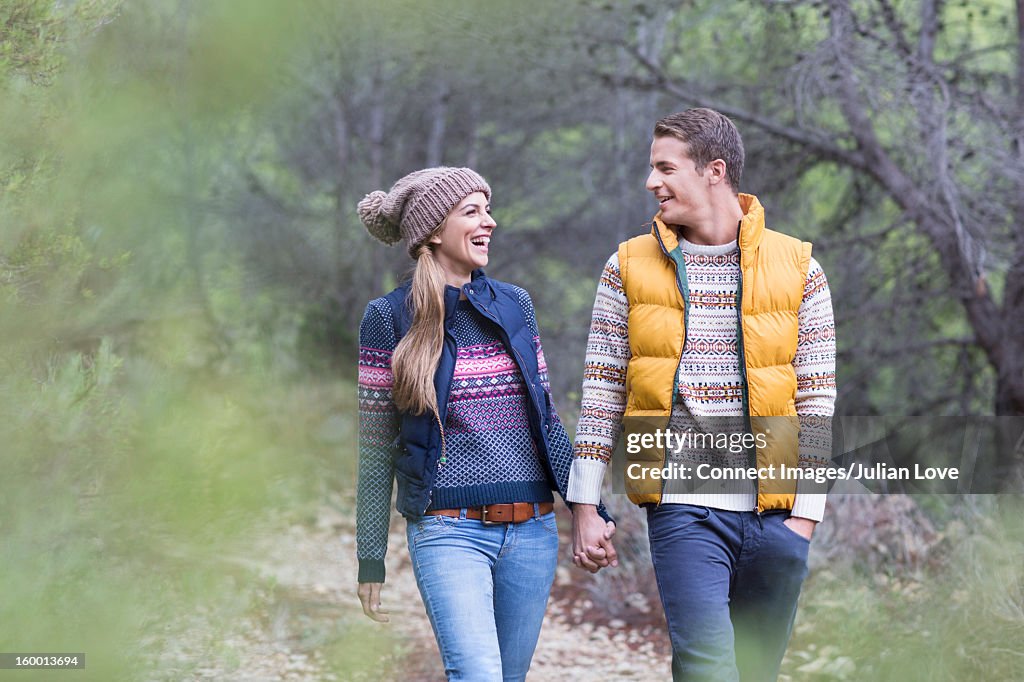 Couple walking together on dirt path