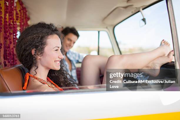 smiling woman relaxing in van - white van profile stock pictures, royalty-free photos & images