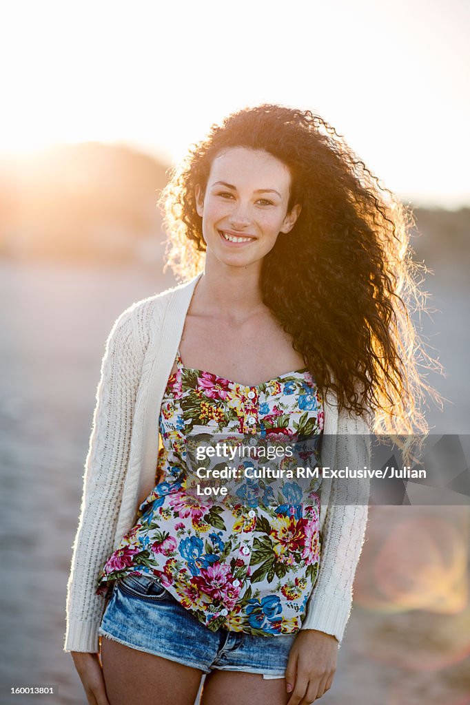 Smiling woman standing on beach