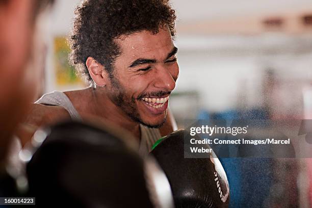 boxer practicing in gym - combat sport stock pictures, royalty-free photos & images