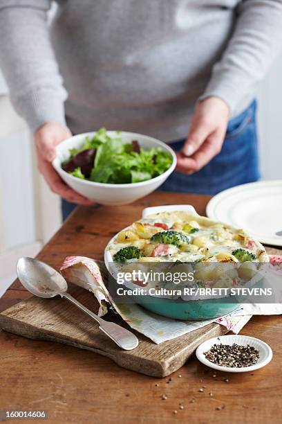 dish of baked ham and leek gnocchi - ovenschotel stockfoto's en -beelden