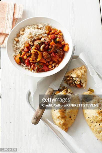 plate of lamb tagine with baked pastries - tajine stock pictures, royalty-free photos & images