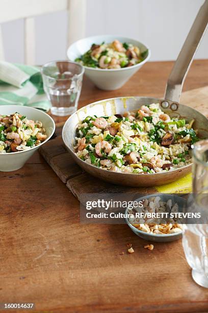 pan of prawn egg fried rice - fried rice stock pictures, royalty-free photos & images