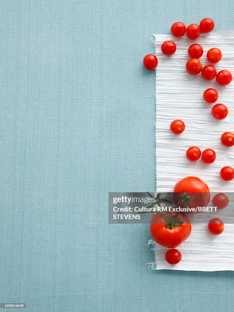 Cherry and vine tomatoes on table