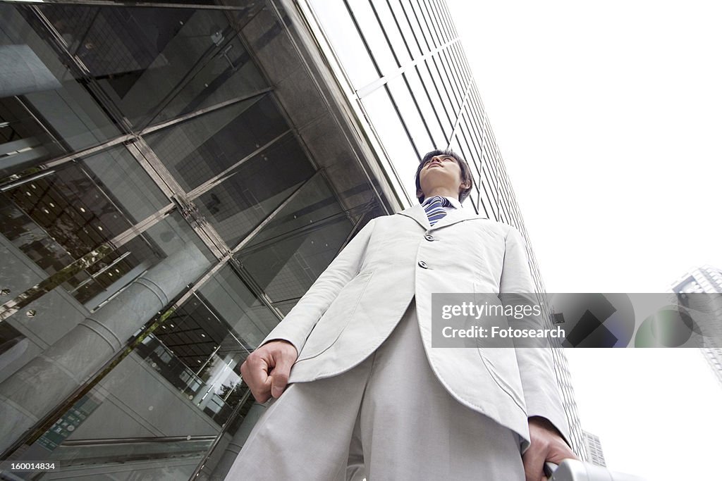 Office worker in front of the building