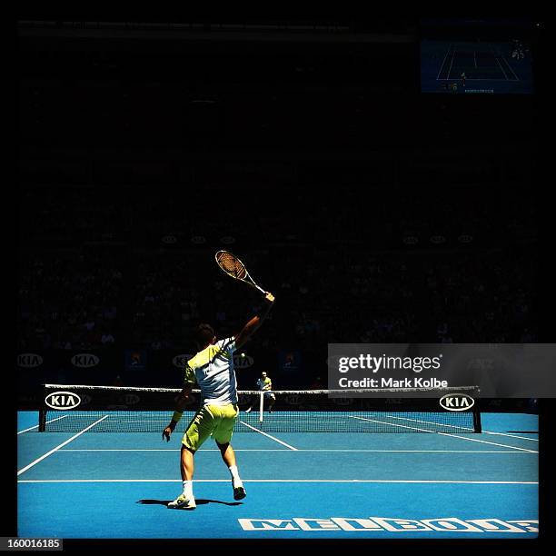 Nicolas Almagro of Spain plays a backhand in his Quarterfinal match against David Ferrer of Spain during day nine of the 2013 Australian Open at...