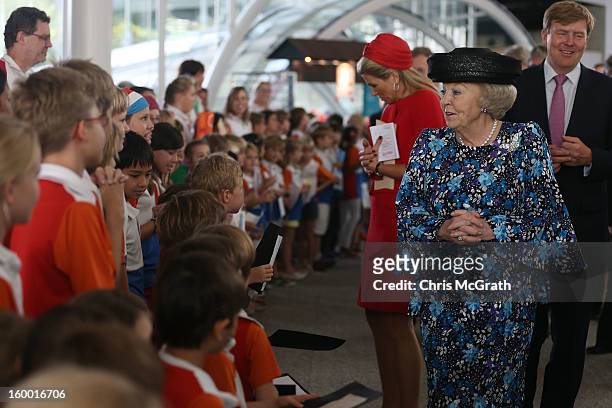 Queen Beatrix of the Netherlands meets dutch students from the Hollandse School after touring the Singapore A*Star Fusionworld on January 25, 2013 in...