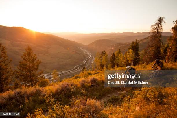 sunset backcountry biking. - vail colorado stock pictures, royalty-free photos & images