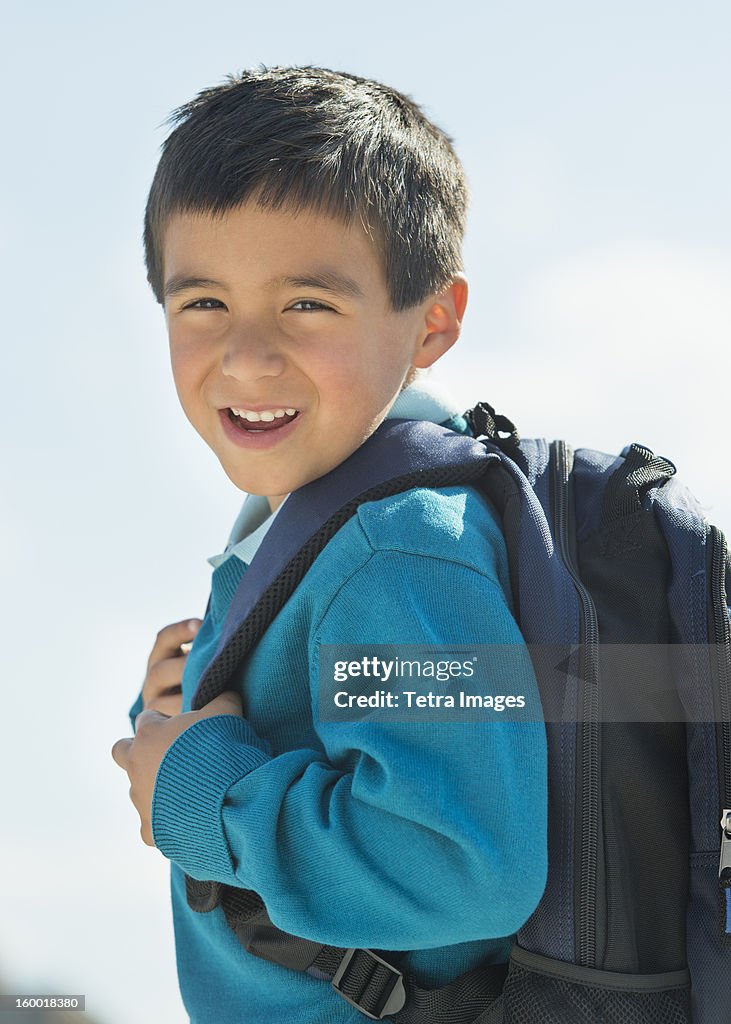 Portrait of boy (6-7) wearing backpack