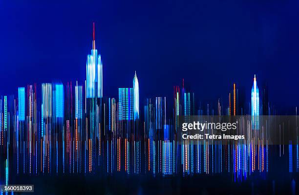 usa, new york city, digitally blurred skyline of manhattan - new york skyline nacht stock-fotos und bilder