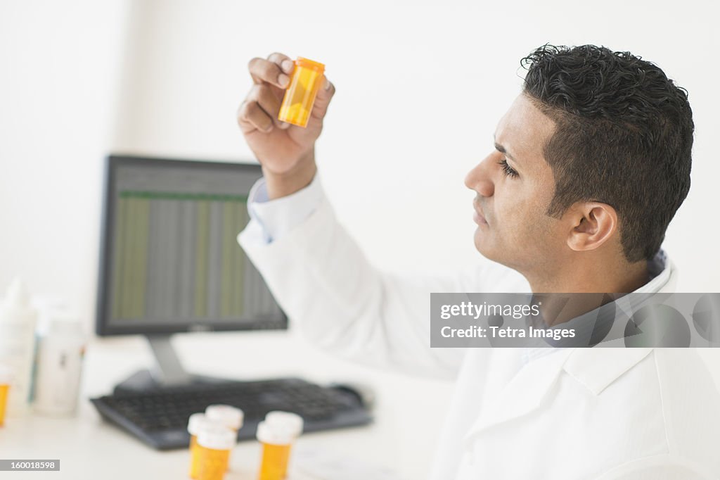 Pharmacist preparing prescription pills