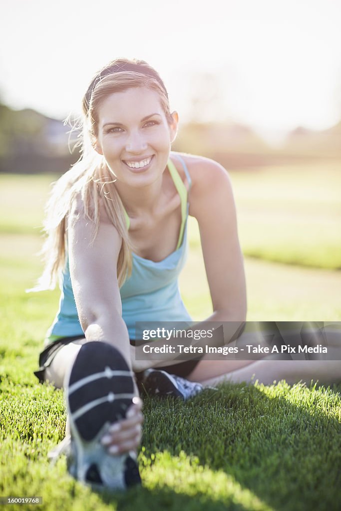 Portrait of smiling woman exercising outdoors