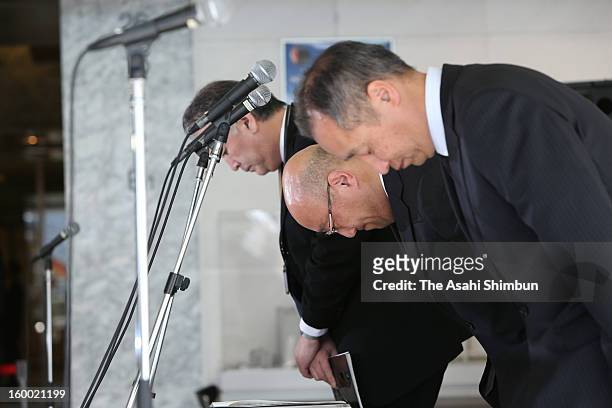 Japanese plant constructor JGC Co president Koichi Kawana bows to commemorate the victims during a press conference at the company headquarters on...