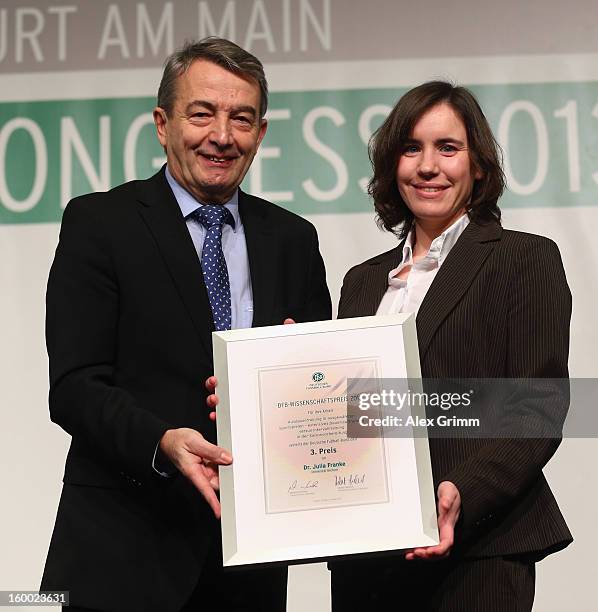 President Wolfgang Niersbach hands over the certificate to DFB Science Award third placed Julia Franke during the DFB Science Congress 2013 at the...