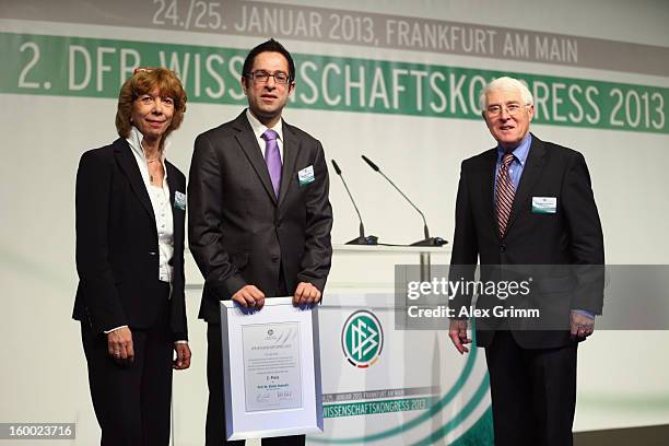 Second placed Stefan Chatrath poses with DOSB vice president Gudrun Doll-Tepper and Martin-Peter Buech, head of the DFB Science department, after the...