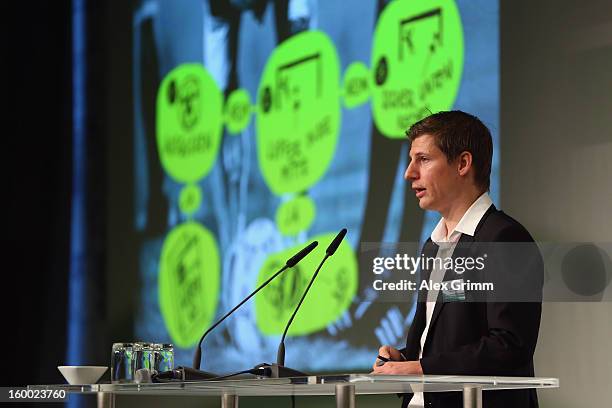 Winner Georg Froese talks on the stage after the DFB Science Award during the DFB Science Congress 2013 at the Steigenberger Airport Hotel on January...