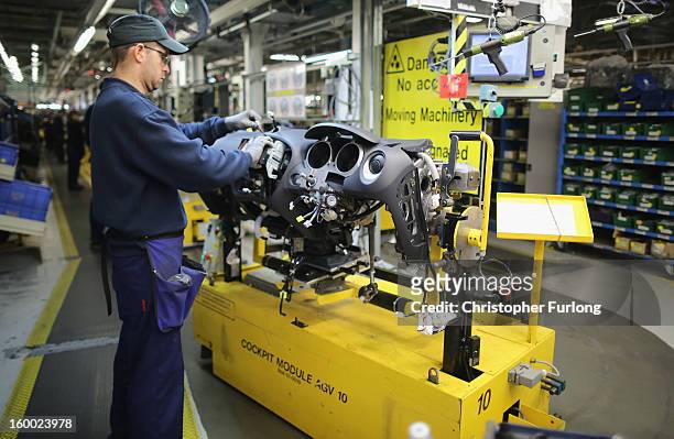 Technician assembles a Nissan car on the production line at Nissan's Sunderland plant on January 24, 2013 in Sunderland, England. The Japanese...