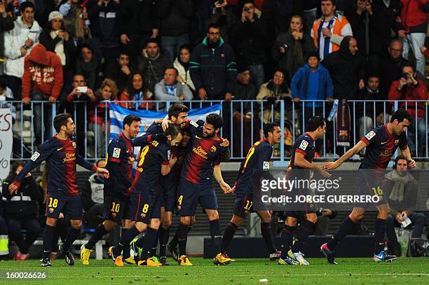 Barcelona's defender Gerard Pique celebrates with his teammates after scoring during the Spanish Copa del Rey quarter-final second leg football match...